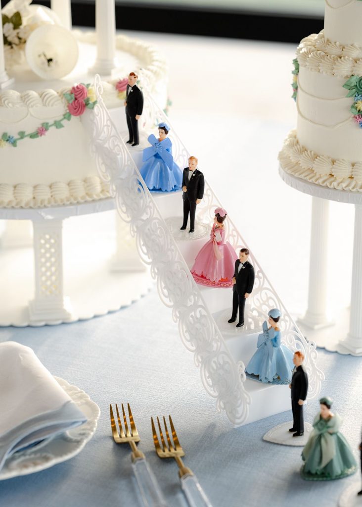 Custom toppers featuring the bride, groom, their bridesmaids, and groomsmen