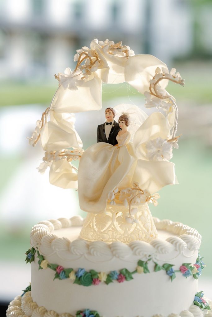 Custom wedding cake toppers of the bride and groom during the Wedding Reception