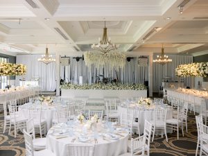 Austin Texas wedding and Event florist, Flora Fetish, creates a lavish ballroom installation featuring lush classic florals for an elegant, elevated wedding celebration.